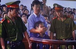 When the priest Nguyen Van Ly went on trial, he was cut short by a police officer, who put his hands over his mouth to stop him talking