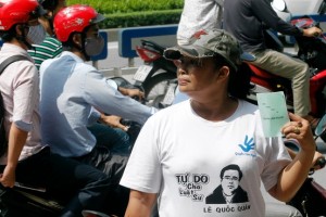 Demonstrators outside the trial of Le Quoc Quan in Hanoi on Oct. 2