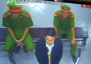 A closed-circuit television image shows Vietnamese democracy activist Pham Van Troi at his trial, Oct. 8, 2009.