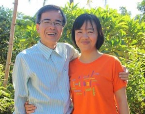 Catholic dissident lawyer Le Quoc Quan (L) poses with his wife Nguyen Thi Hien